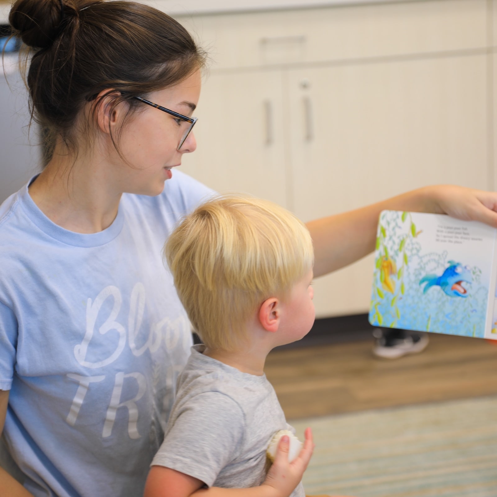 Bloom educator reading with a child
